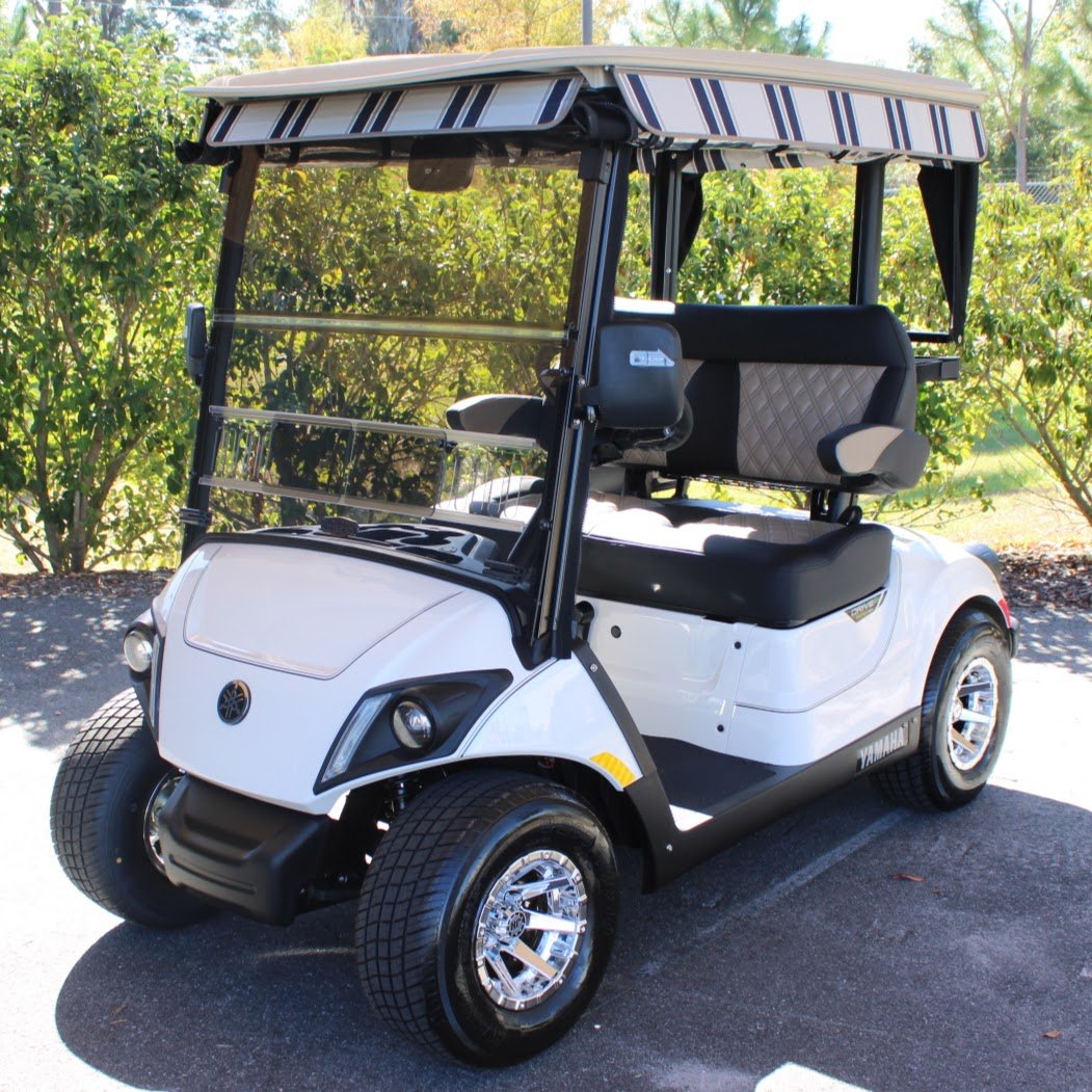 Golf cart parked on pavement, used for a guide to E-Z-GO RXV brakes locking up and the electronic brake reset
