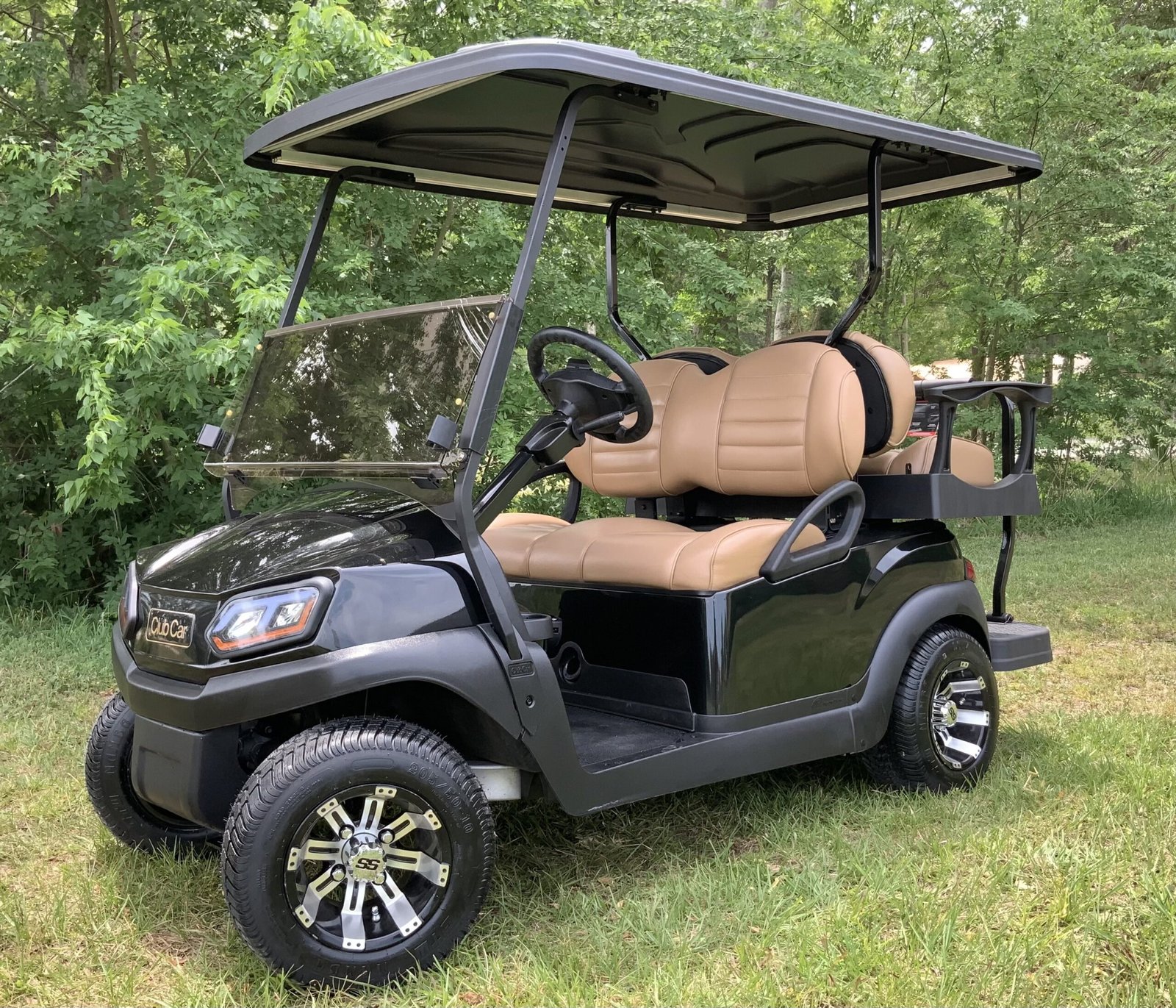Lifted black golf cart used to discuss ride quality on the street after a lift kit