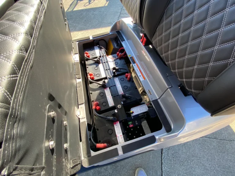 How a golf cart works: battery pack, cables, and wiring under the seat