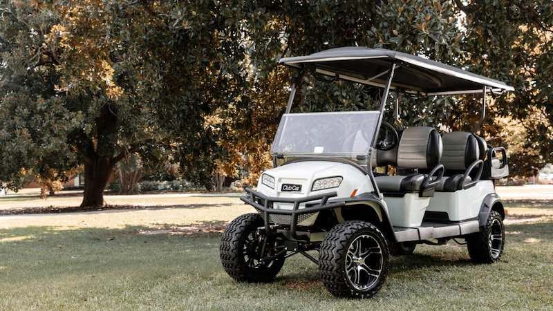 Six passenger golf cart used to assess whether a weather enclosure is worth buying