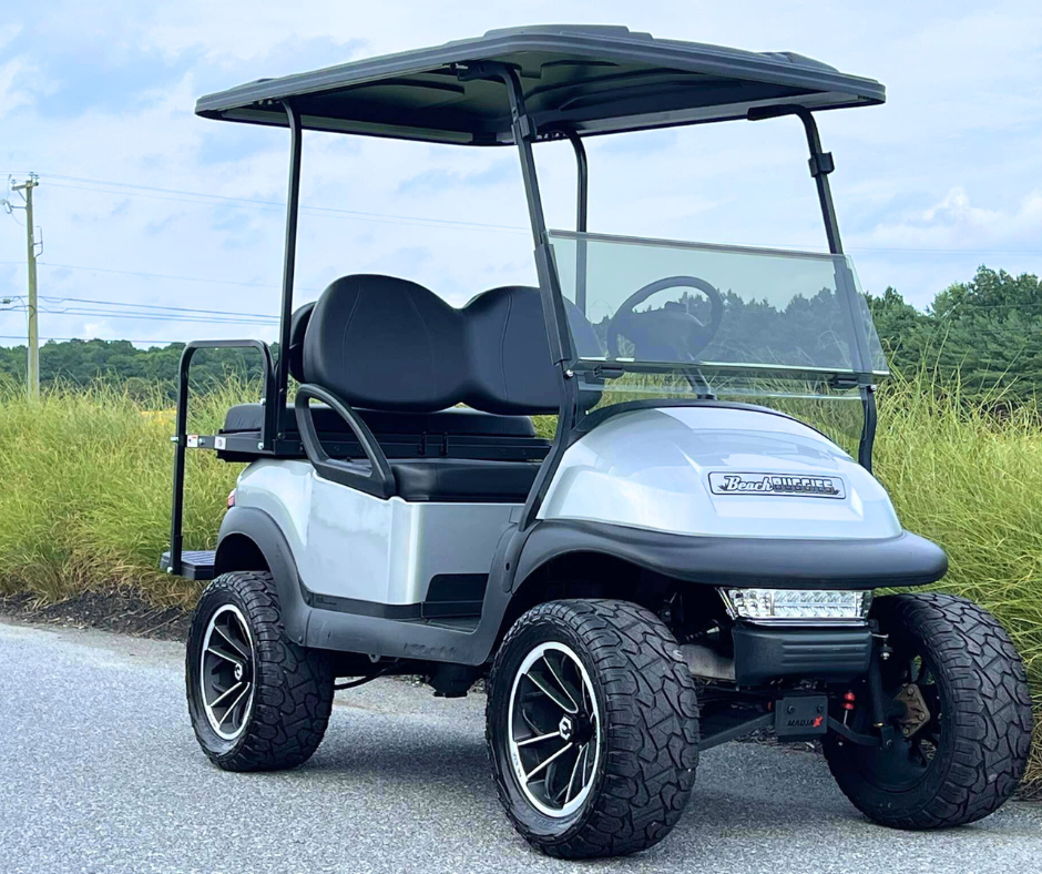 Lifted golf cart used to explain what a stuck golf cart solenoid means and how it behaves