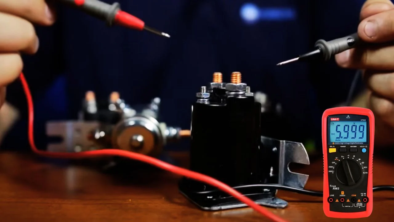 Technician testing a golf cart solenoid with a multimeter reading voltage across the large terminals