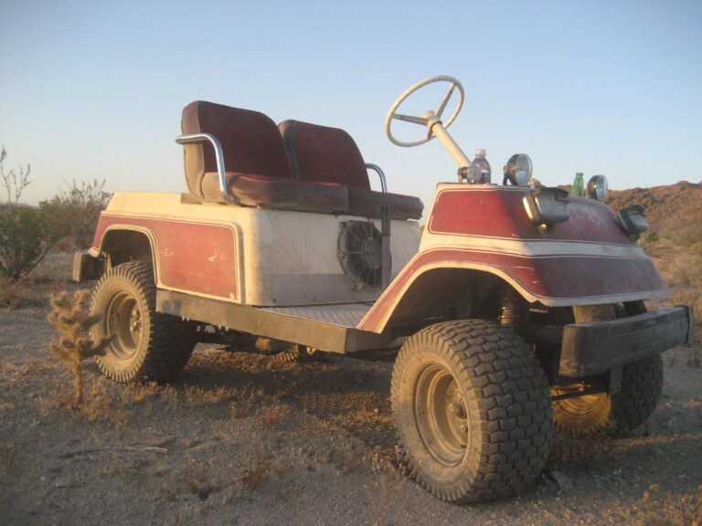 lifted off road all terrain golf cart with knobby tires