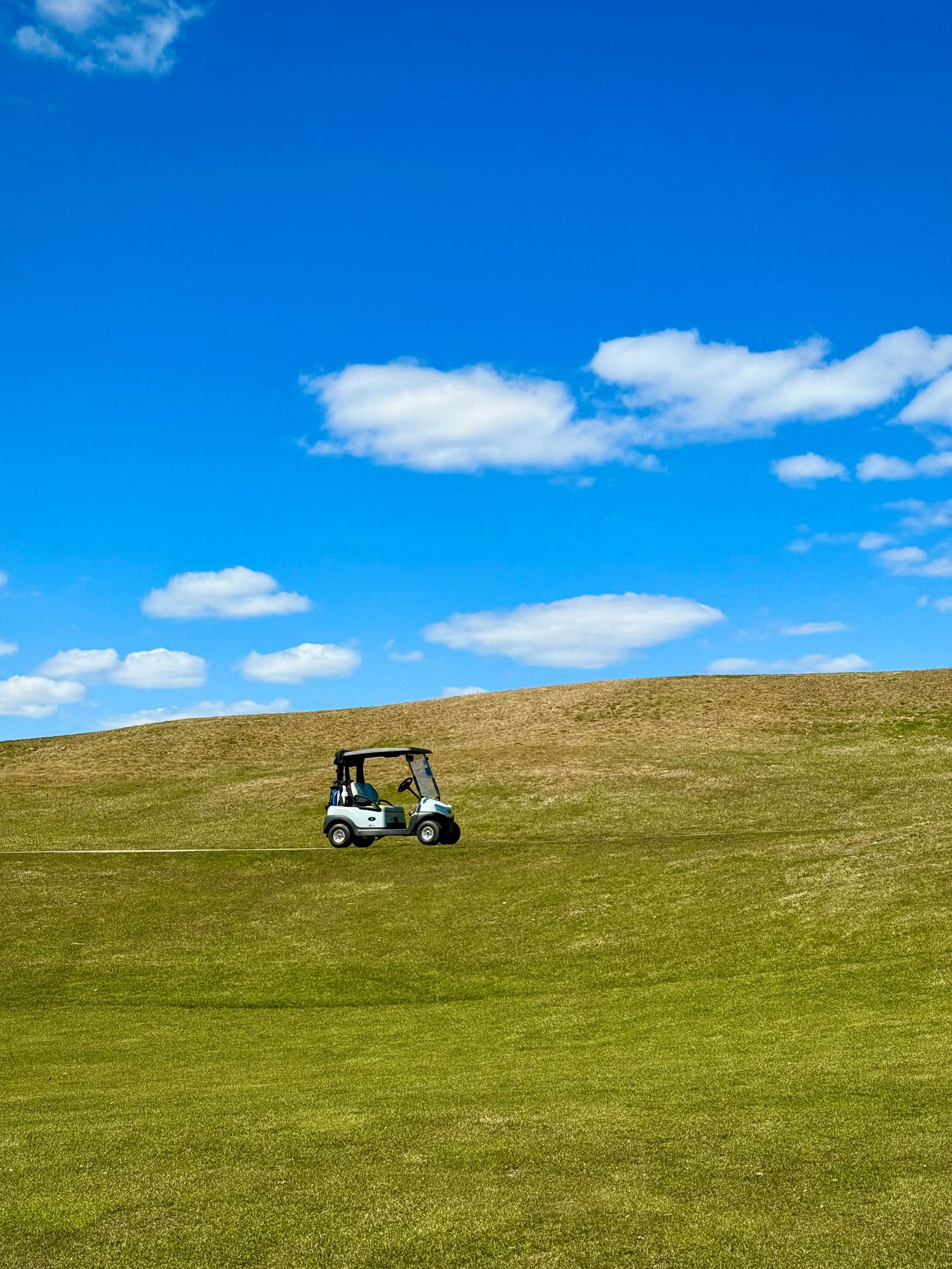 golf cart on green hills showing long lifespan