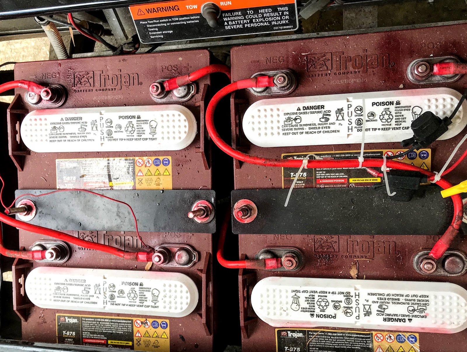 Golf cart battery brands ranked, a Trojan deep-cycle pack installed in a cart