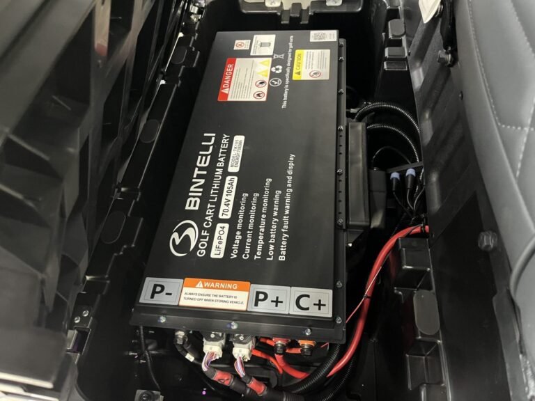 Bintelli branded lithium golf cart battery pack under the seat, relevant to Bintelli golf cart lithium battery problems