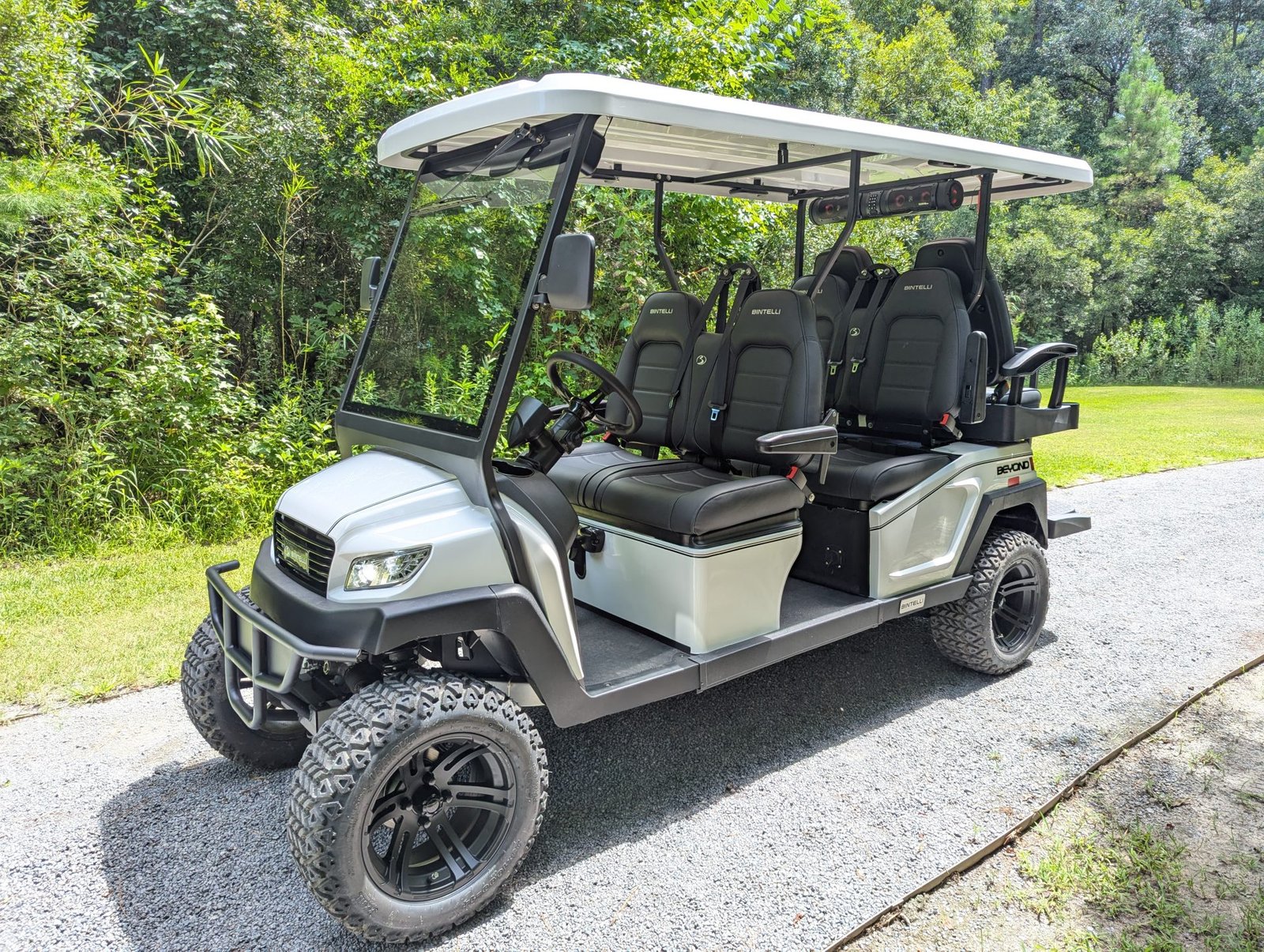 Bintelli Beyond golf cart climbing a hill, illustrating slow hill power diagnosis
