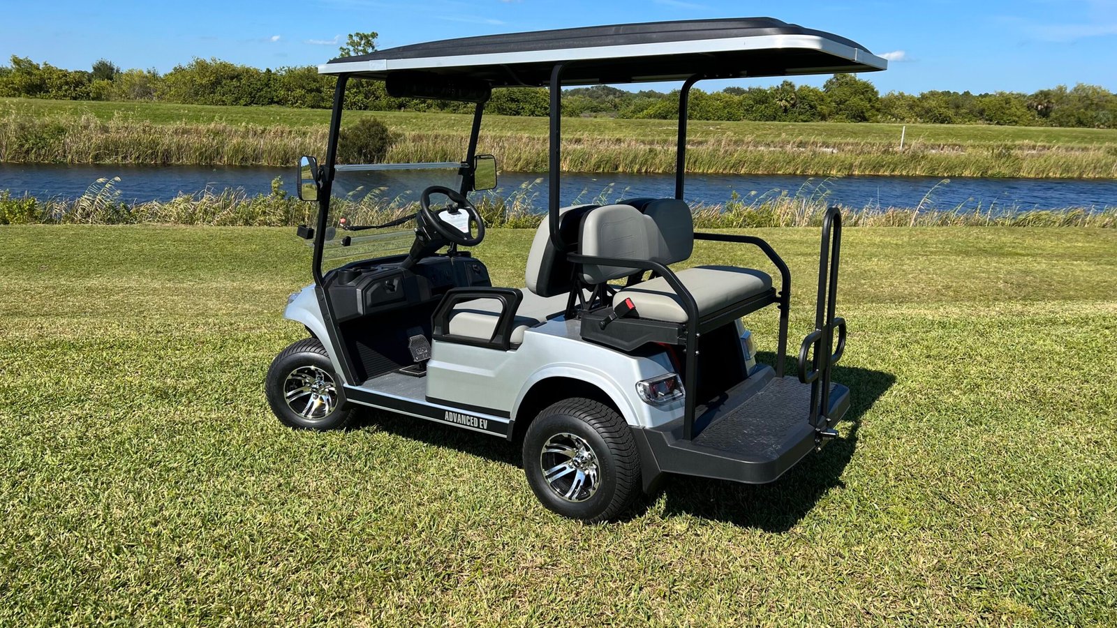 Advanced EV golf cart on a fairway, used for an owner guide to common Advanced EV faults