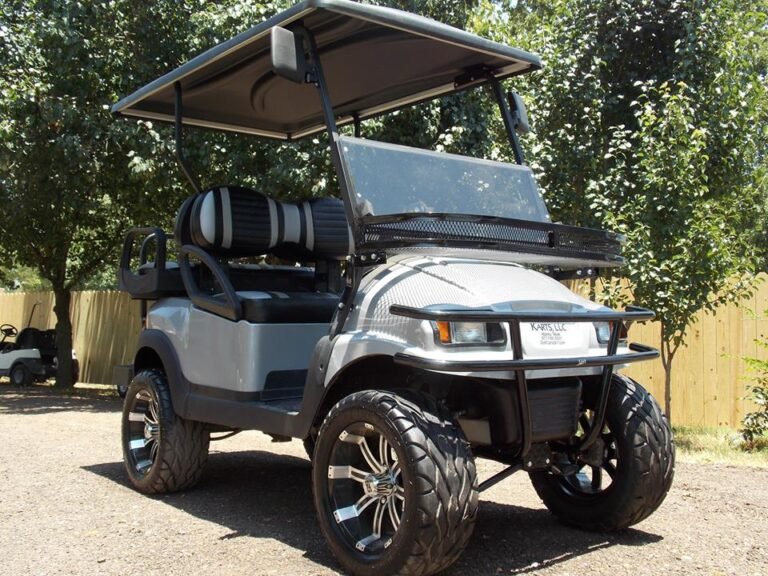 Lifted golf cart used to illustrate forward and reverse switch testing and replacement