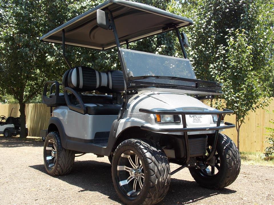 Lifted golf cart used to illustrate forward and reverse switch testing and replacement