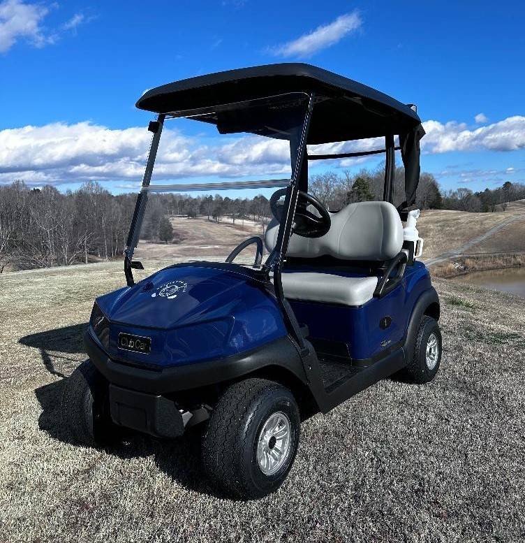 Golf cart on a course, used to explain how regenerative braking works and why it fails