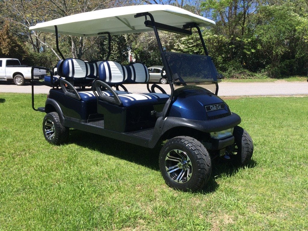 Golf cart parked on grass, used for a guide to finding the serial number and VIN by brand