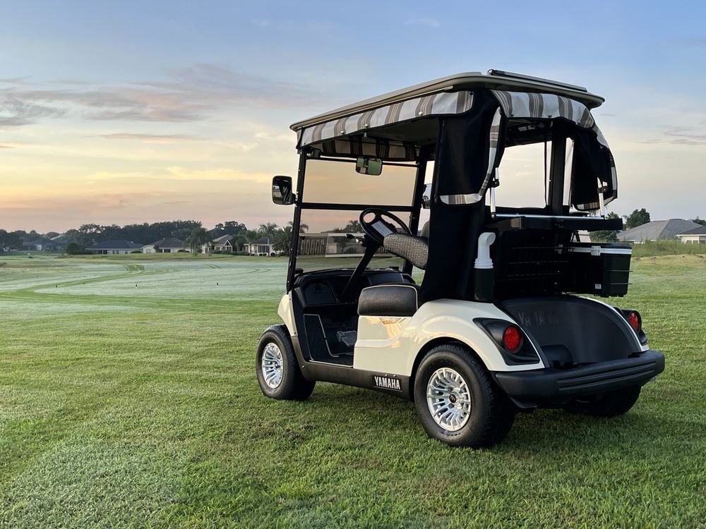 Golf cart at rest used to illustrate bench and in-cart drive motor testing