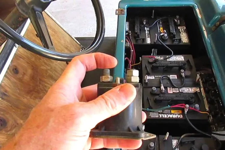 Golf cart solenoid held in hand beside the battery bay, used for Trombetta 684-3681-012-14 specifications